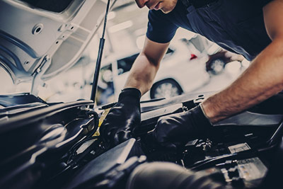 Mechanic checking the engine - Car Servicing Leighton Buzzard